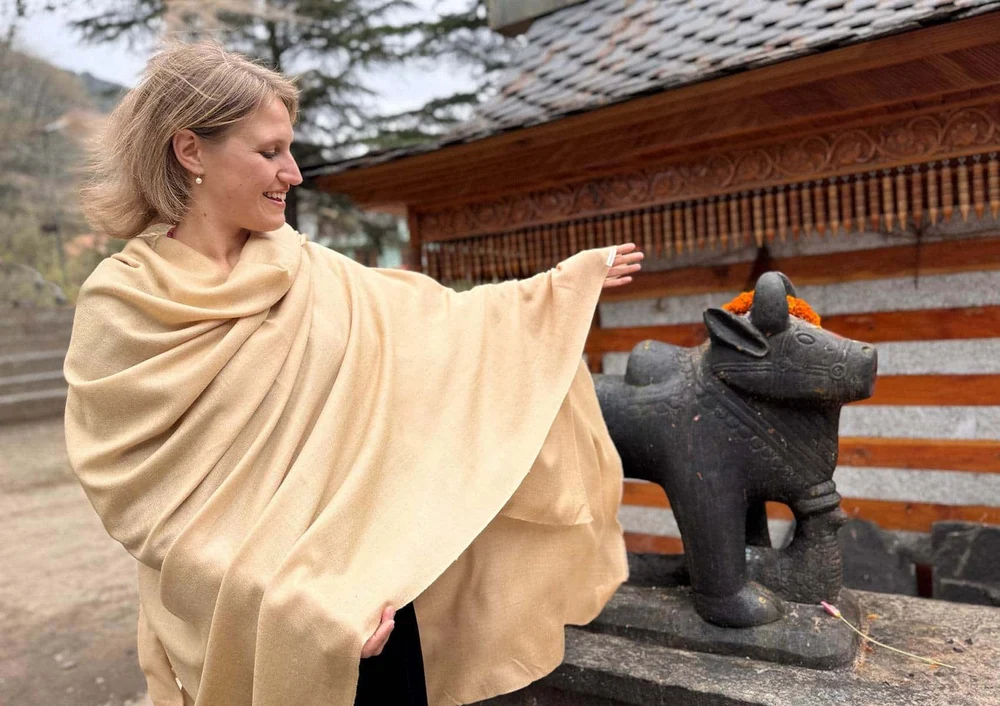 Merino silk meditation wrap worn over the shoulders and lap during outdoor meditation